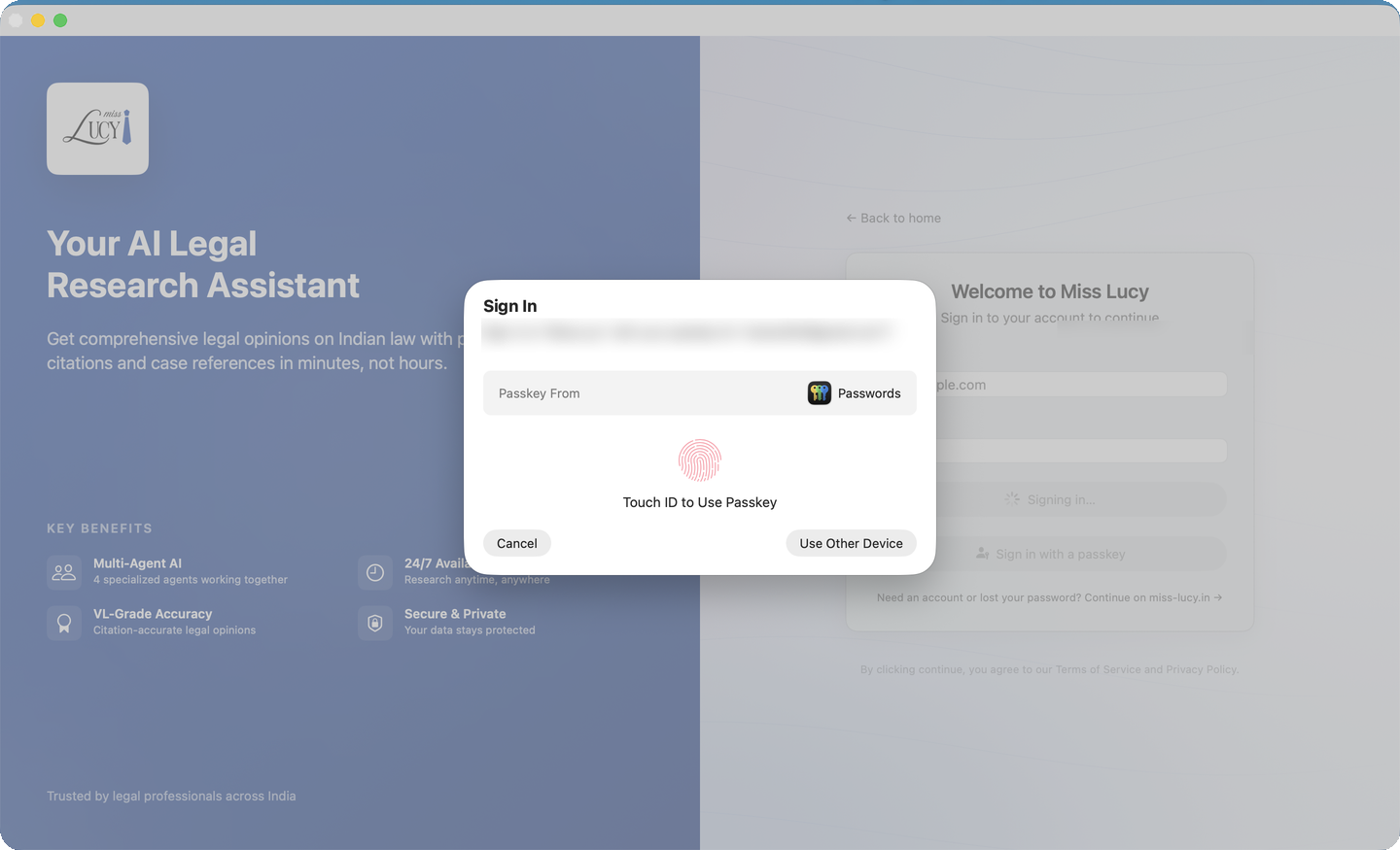 Miss Lucy's Mac sign-in with the Touch ID passkey prompt — no password field in sight